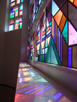 Glas-in-loodramen van Jacoba van Heemskerck, ontwerp uit 1921.
<br/>
Foto-archief GGD Amsterdam, 2010